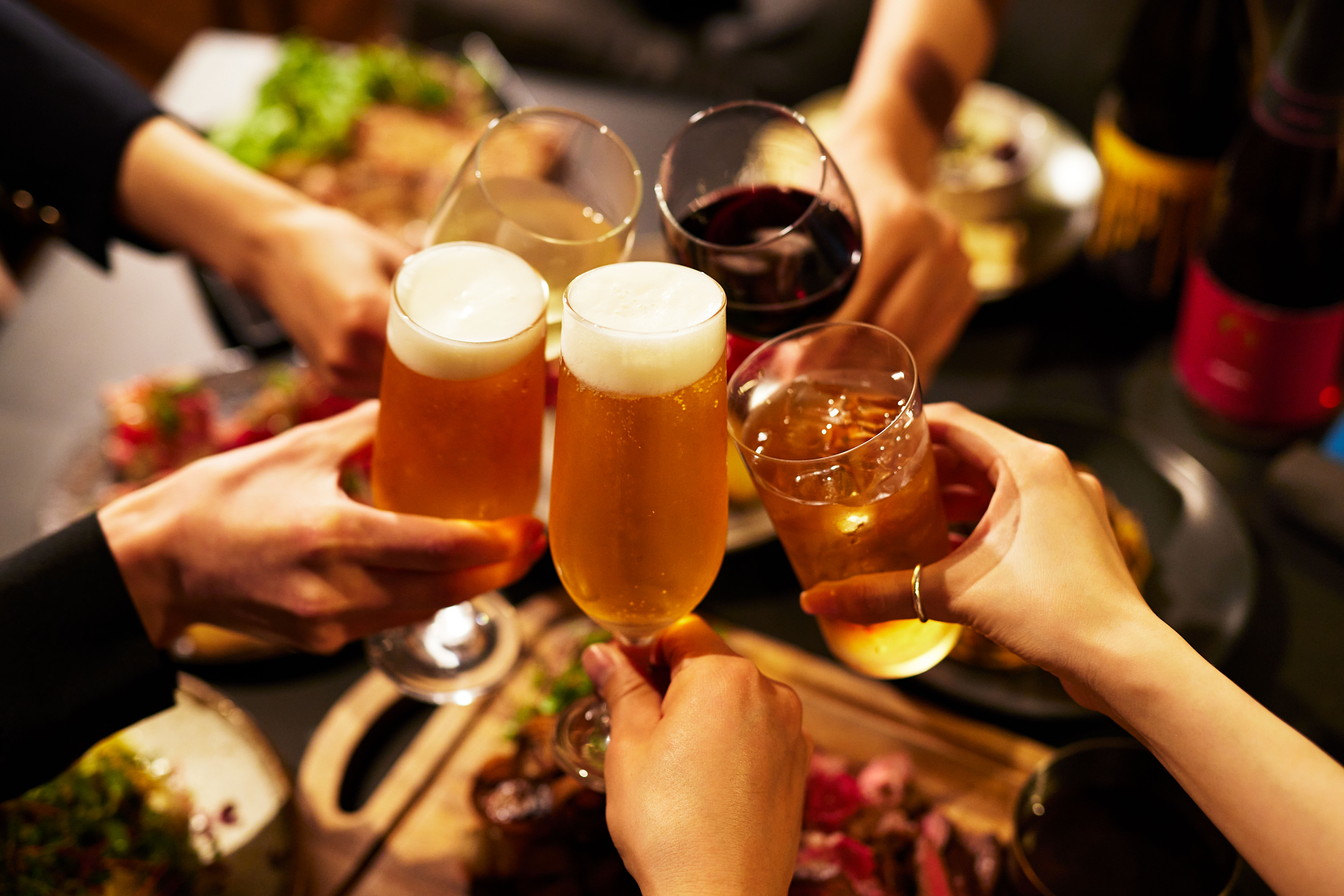 Cheers with drinks and food